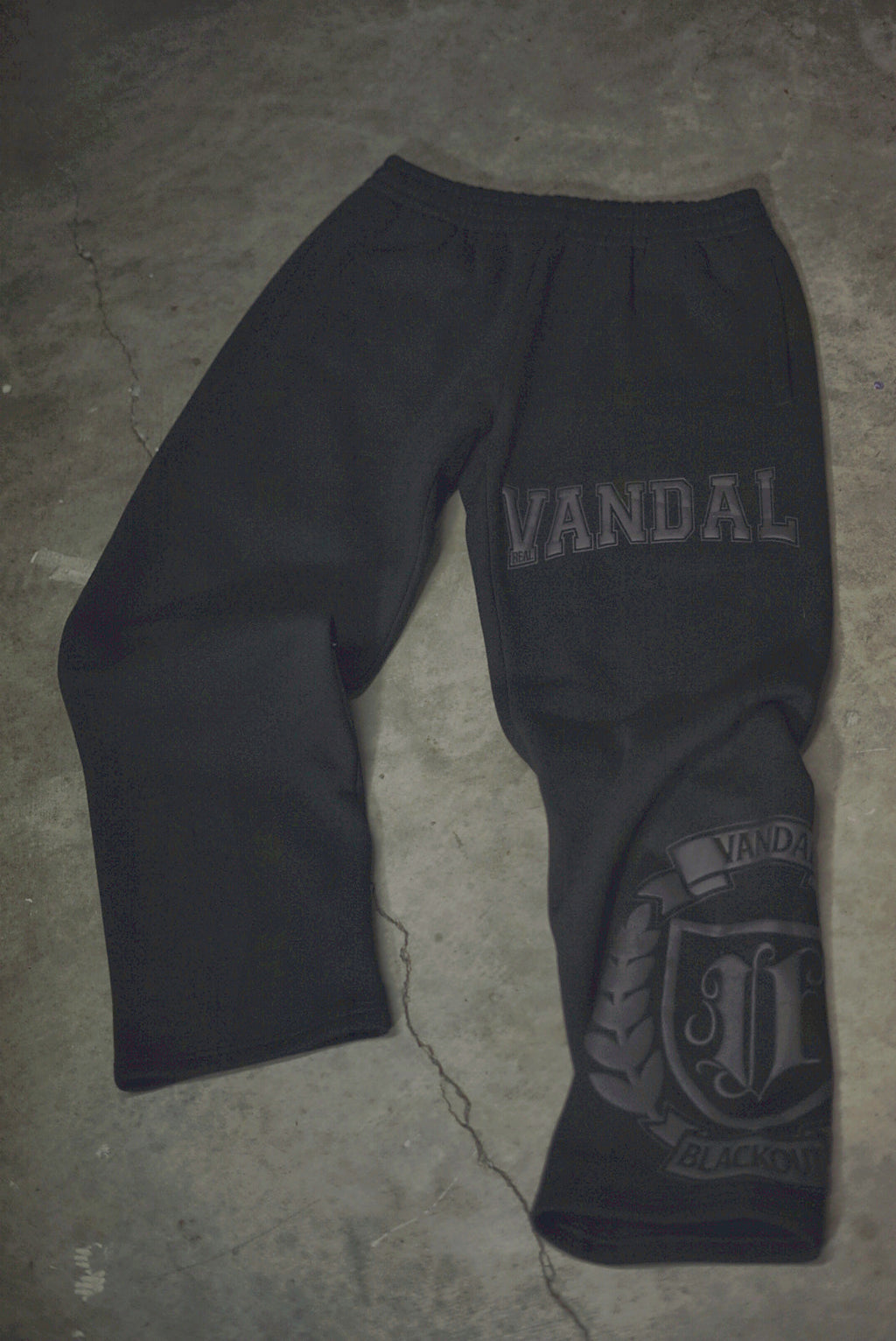 Vandals Varsity Sweats in black, flat lay