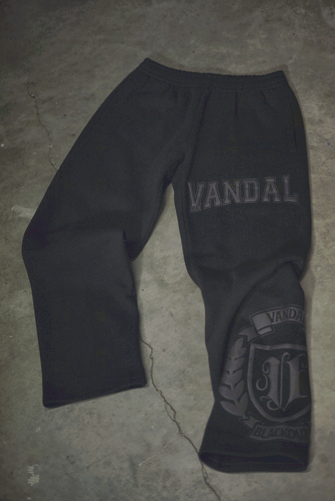 Vandals Varsity Sweats in black, flat lay
