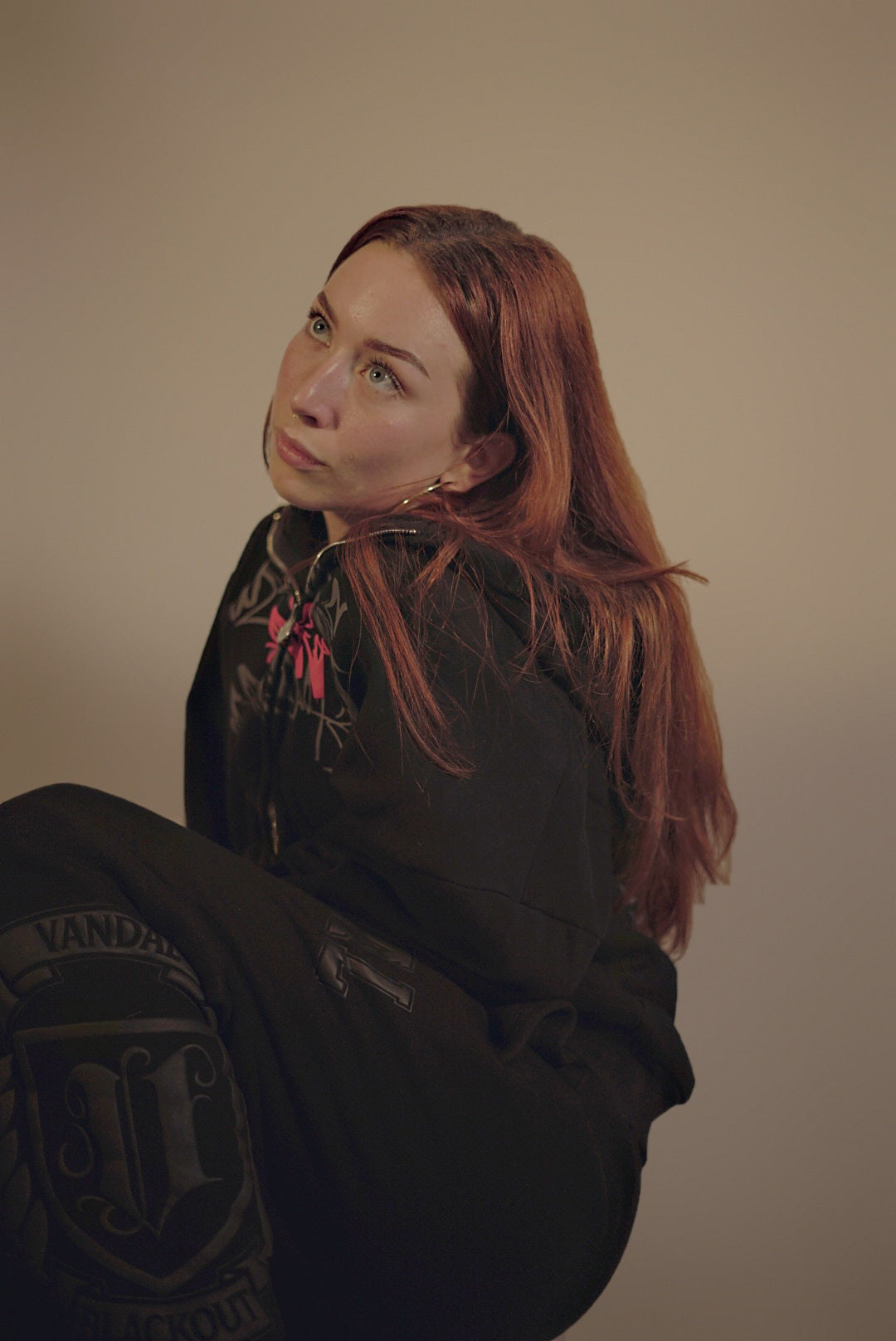 Model in Vandals zip-up and Varsity Sweats